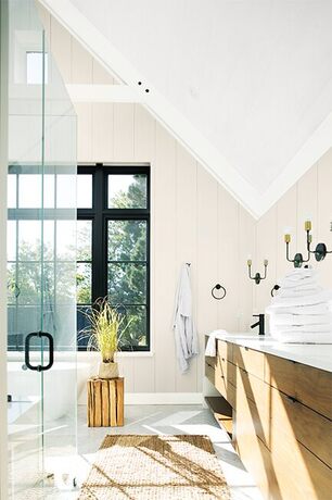 A light and airy bathroom painted in neutral and white paint colors