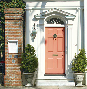 The orange paint used on this city home's front door features Gennex® Color Technology.