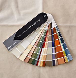 A Benjamin Moore fan deck sitting on a table A Benjamin Moore fan deck sitting on a table