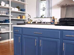 Cool blue kitchen color scheme with blue kitchen cabinets.