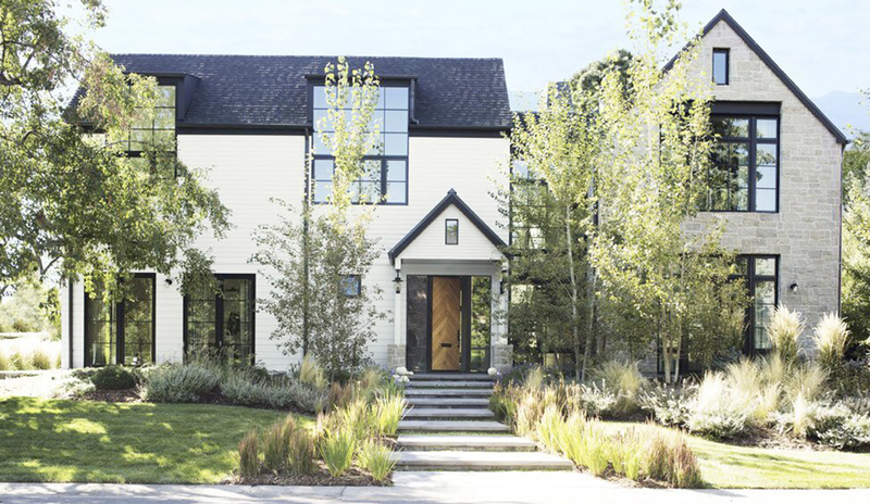 Modern country style home with white exterior and dark trim