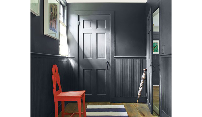 Red chair in a mudroom with walls painted in Soot 2129-20. Red chair in a mudroom with walls painted in Soot 2129-20.