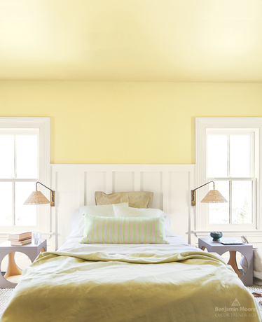 A bedroom in Beacon Hill Damask HC-2 with trim and wainscotting painted in Atrium White OC-145.