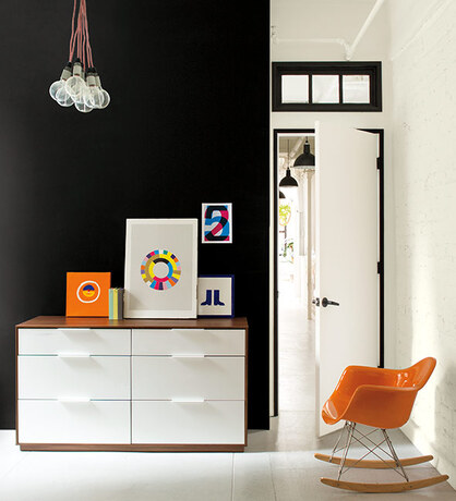 Black painted accent wall in entryway Black painted accent wall in entryway