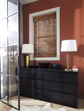 Cinnamon brown painted bedroom with White Heron-painted ceiling and trim, off-white rug.