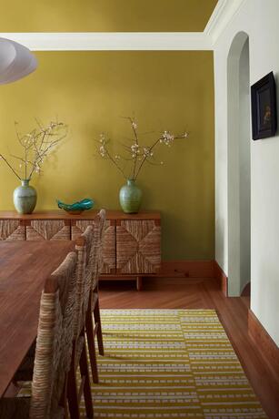 Dining room with accent wall painted in Savannah Green and ceiling in a White Heron.