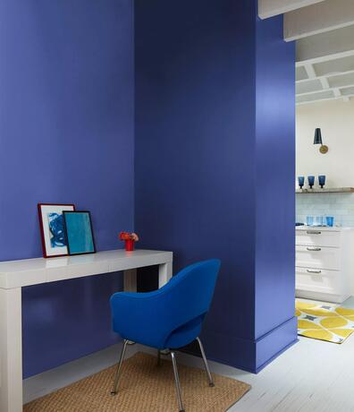 Starry Night Blue-painted accent wall in an open-concept space.